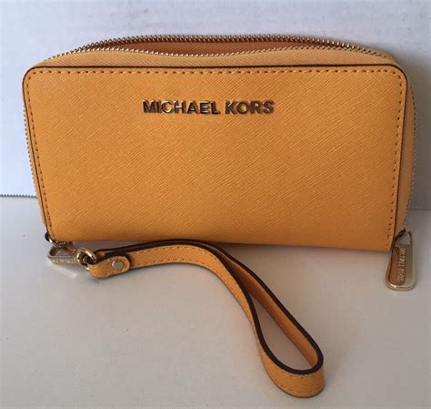 michael michael kors mercer leather multi function phone wristlet|Large Scalloped Leather Smartphone Wristlet .